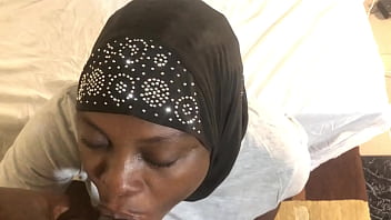Neighbor fucks in the mouth of an African countrywoman in a headscarf
